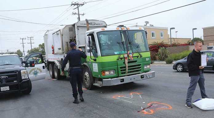 Man struck by garbage truck