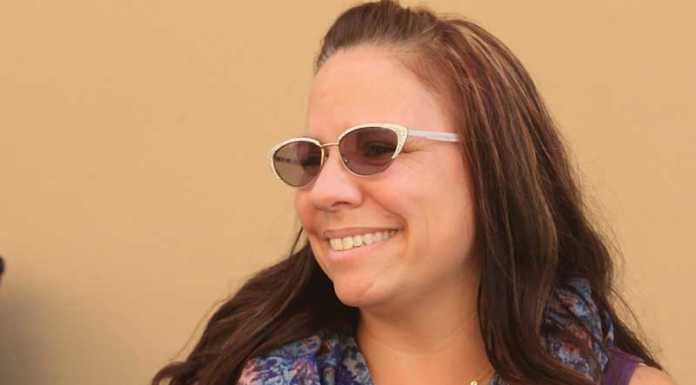 Teacher earns Ph.D. in front of school audience