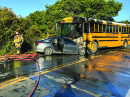 School bus bursts into flames after crash