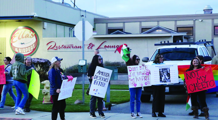 Trump viewing party draws supporters, counter-protest
