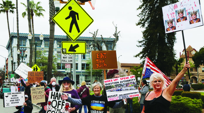 Locals rally against President Trump