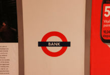 The Slow Death of Bank Transfers A sign for a bank, illustrating the traditional financial systems that instant withdrawal casinos are moving beyond