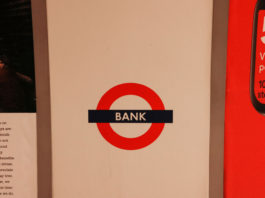 The Slow Death of Bank Transfers A sign for a bank, illustrating the traditional financial systems that instant withdrawal casinos are moving beyond